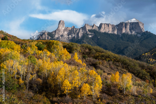 USA, Colorado, Uncompahgre National Forest. Sunset on aspens and mountain roc...