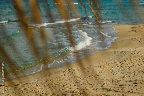Calm Beach Scene with Sand and Gentle Waves