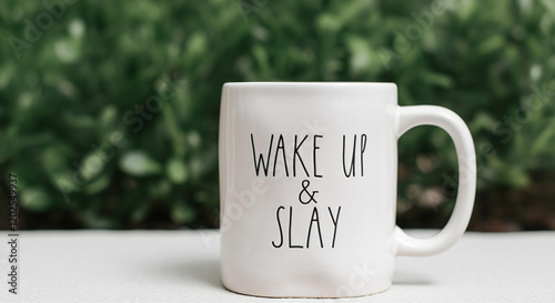 Coffee mug with wake up message in a natural setting for morning routines and daily inspiration photo