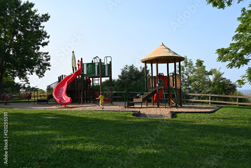 child playing on playground in park,