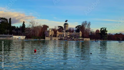 Slow motion birds flying over retiro park lake in madrid photo