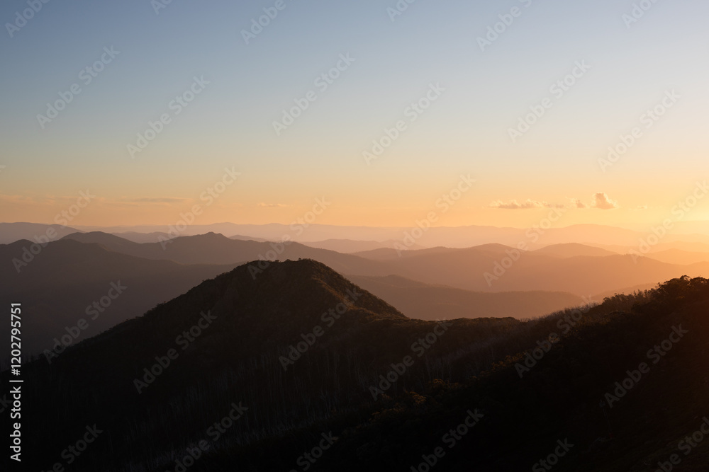 mountain range orange sunset clouds sky mountain range orange sunset clouds sky