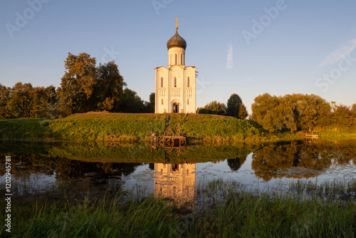 View of the medieval Church of the Intercession of the Holy Virgin on the Nerl on a warm September evening. Vladimir Region, Russia