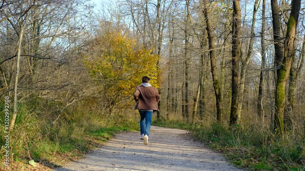 Man runing autumn forest