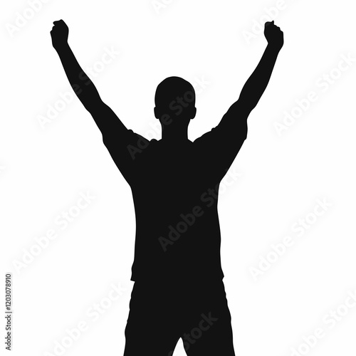 A man is standing with his arms raised in the air. He is wearing a black shirt and black shorts