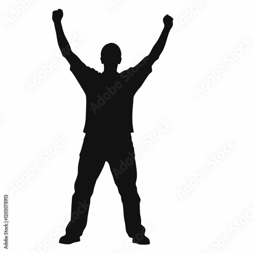 A man is standing with his arms raised in the air. He is wearing a black shirt and black shorts