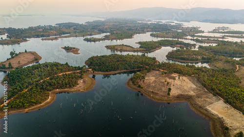 Drone fly scenic sunset landscape above flooded Islands of Laos Thakhek Loop, motorcycle ride natural view