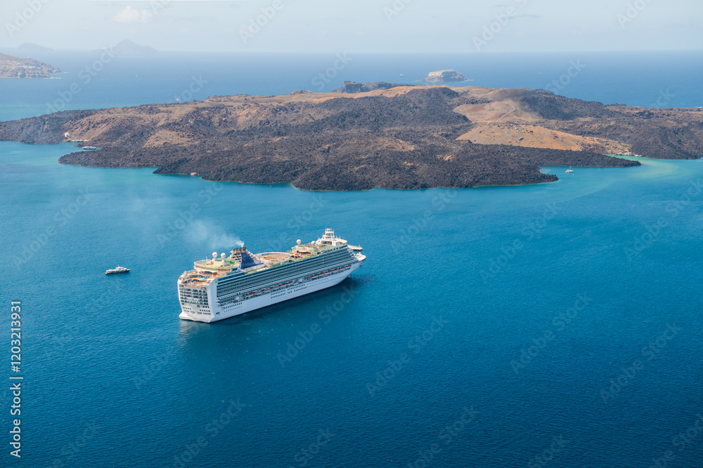 Santorini island, Greece. Cruise ship near the coast. Blue sea and the blue sky.