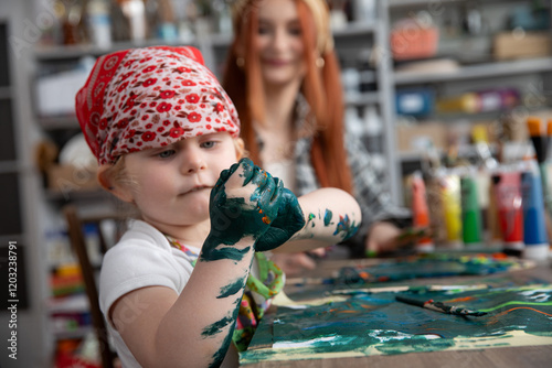 A Creative Child Engaged in Playful Painting Activities Inside an Art Studio Environment