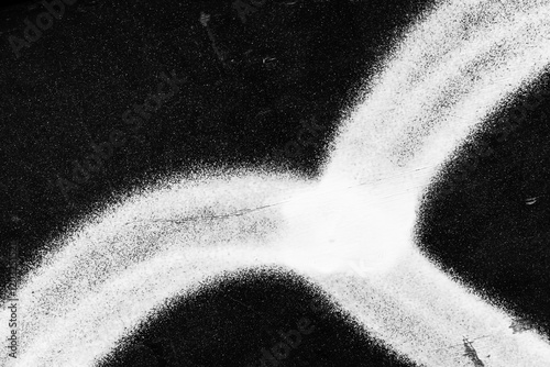 Abstract monochrome graffiti fragment, black urban metal wall