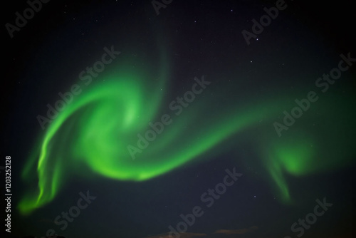 display of Northern Lights with swirling green red and orange patterns photo