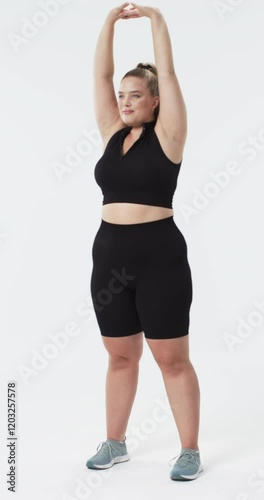 Wallpaper Mural Vertical video: Stretching with arms raised, plus size woman in athletic wear promoting body positiv Torontodigital.ca