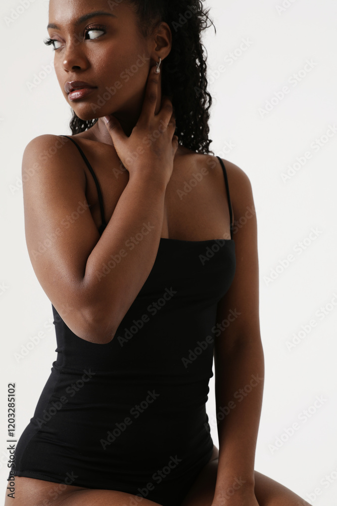 Portrait of young lovely woman with dark skin isolated over white background looking away. Portrait of young lovely woman with dark skin isolated over white background looking away.