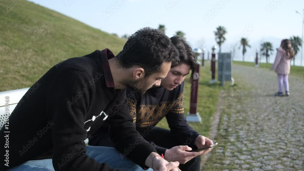 Two Men Spend Time With Phone Two Men Spend Time With Phone