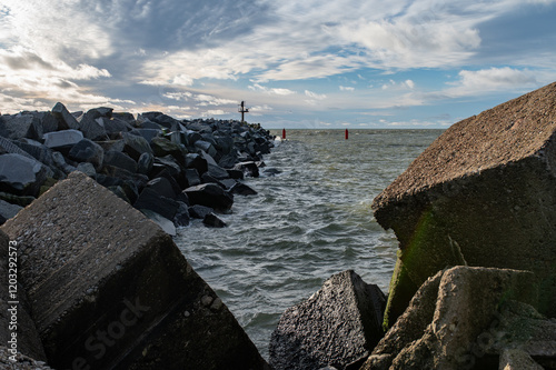Climate change. Rising water level. concrete tetrapod breakwaters lie all along the coast, the coast breakwaters protecting from large waves, toned image photo