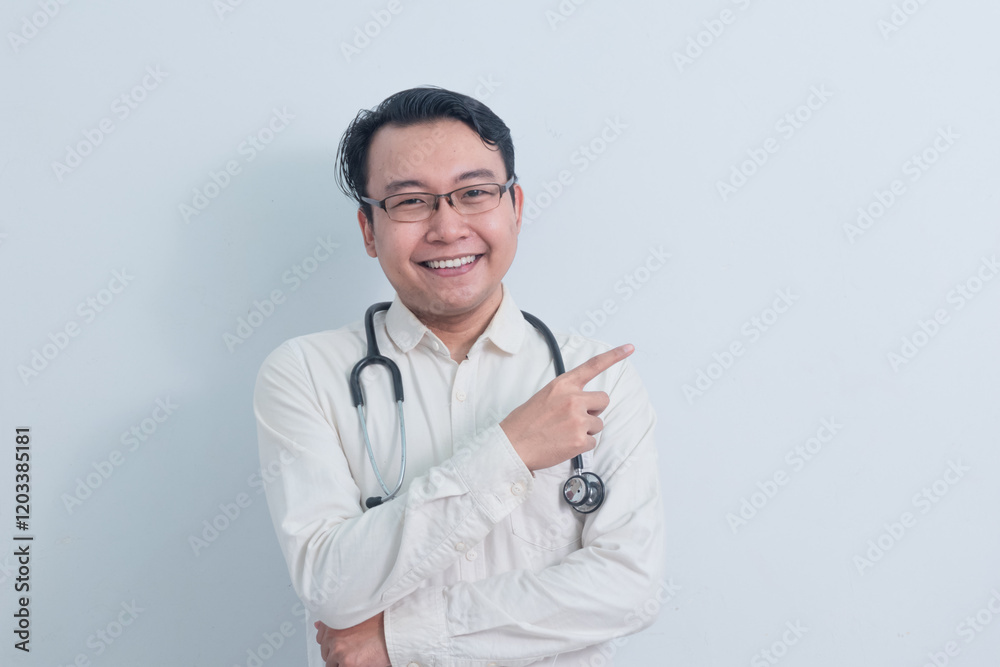 joyful Asian man doctor, male nurse pointing pose isolated white background. joyful Asian man doctor, male nurse pointing pose isolated white background.