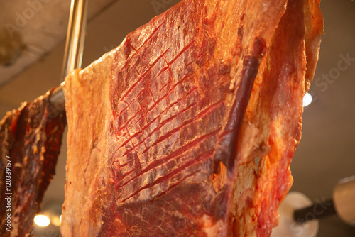 Cecina from Oaxaca. Mexican sliced cured pork or beef meat from Oaxaca displayed in a butcher shop in a mexican food market. photo