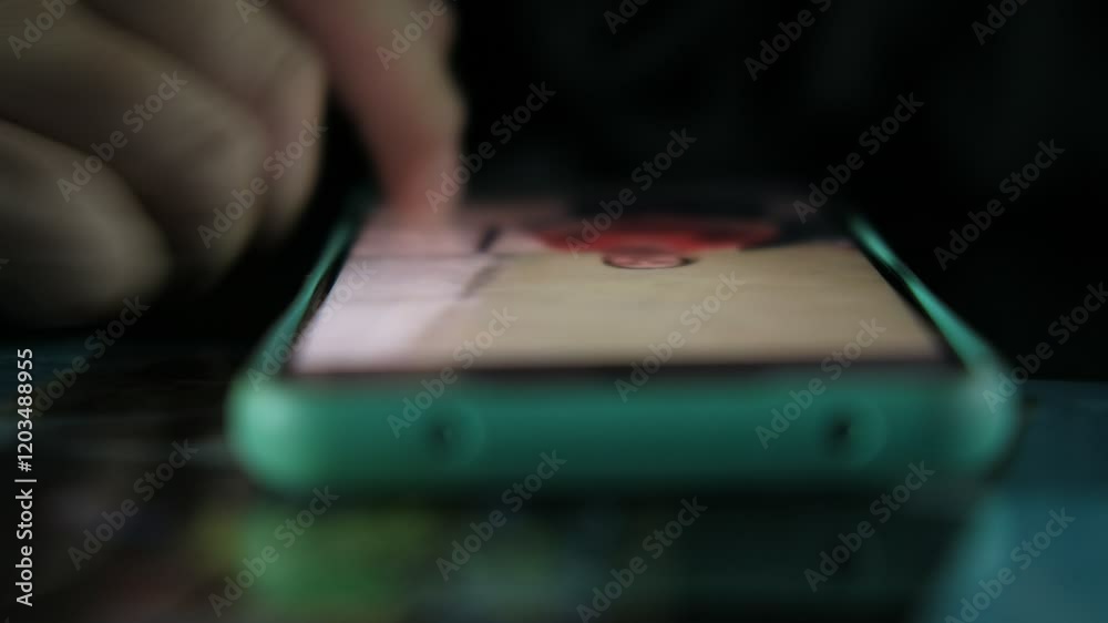 Close-up fingers in mobile phone