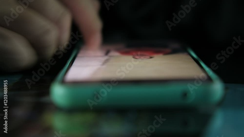 Close-up fingers in mobile phone
