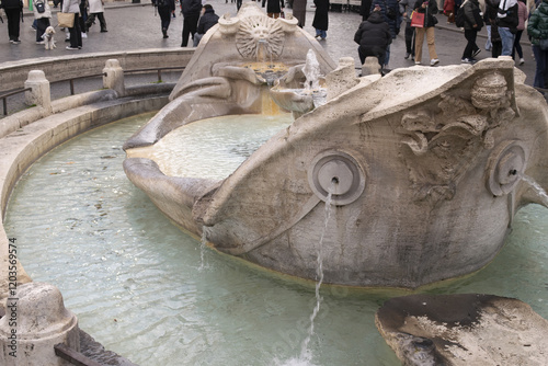 Barcaccia fountain in Rome, Italy photo