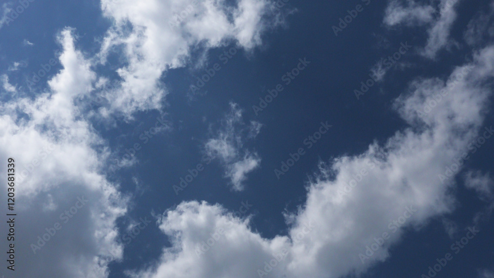 White clouds scattered in the blue sky White clouds scattered in the blue sky