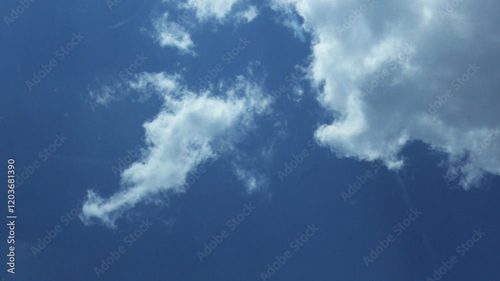 White clouds scattered in the blue sky White clouds scattered in the blue sky