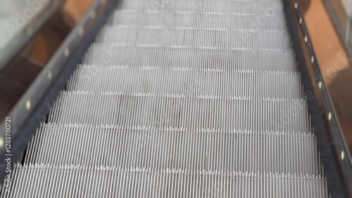 Video of walking down an escalator with dynamic motion.
