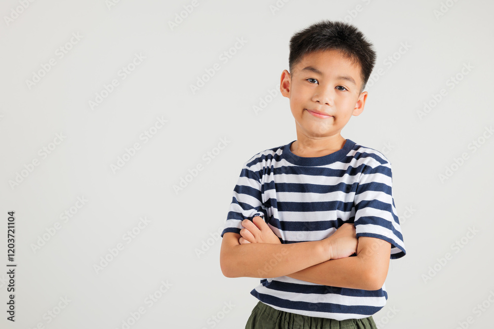 Asian happy portrait cute young kid boy smiling confidence with arms crossed studio shot isolated on white background and copy space, primary children person lifestyle arm folded Asian happy portrait cute young kid boy smiling confidence with arms crossed studio shot isolated on white background and copy space, primary children person lifestyle arm folded