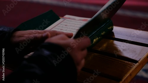 green quran with opened cover