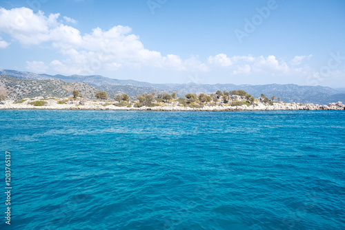 Fototapeta Naklejka Na Ścianę i Meble -  Beautiful bay near Kekova island and Kas in Antalya province, Turkiye. Sunny summer in seaside. Turquoise water.