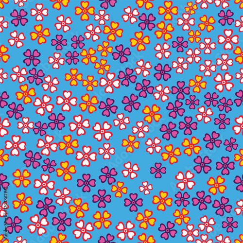 Flowers scattered on a seamless blue background.