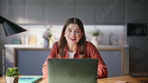 Overjoyed woman waving hand talking laptop virtual chat emotionally closeup photo