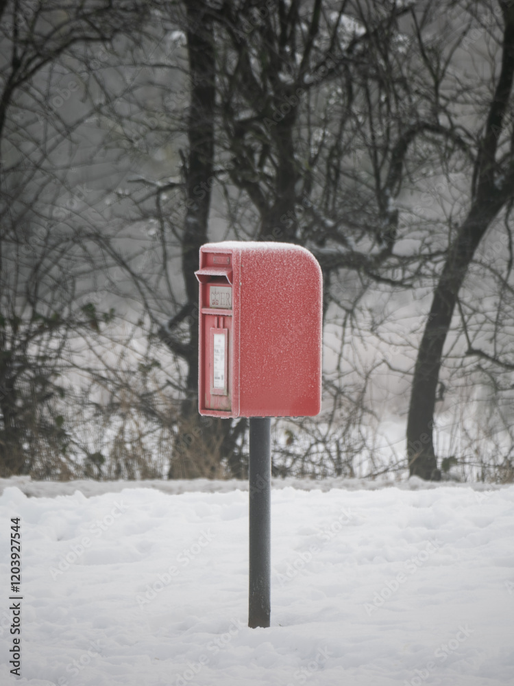 A frosty small post box on a cold winters day A frosty small post box on a cold winters day