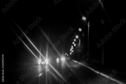 Blurred image of car lights on the road at night. Abstract background.