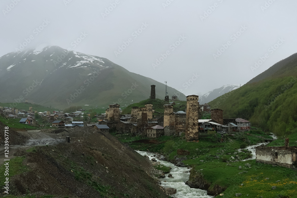 Fototapeta premium Ushguli village, Svaneti, Georgia. The high mountain village in the fog in spring, May