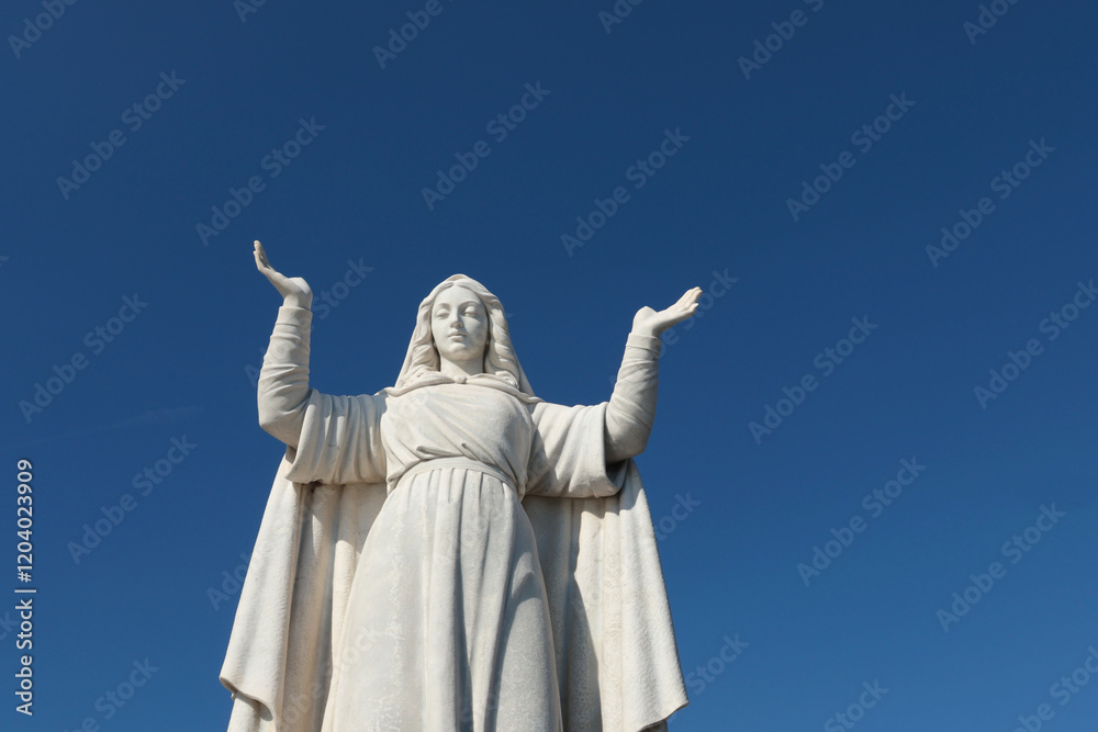Fototapeta premium Santa Margherita, Italy - November 13, 2024. Statue to on sky background. Tourism and recreation. Faith and religion. 