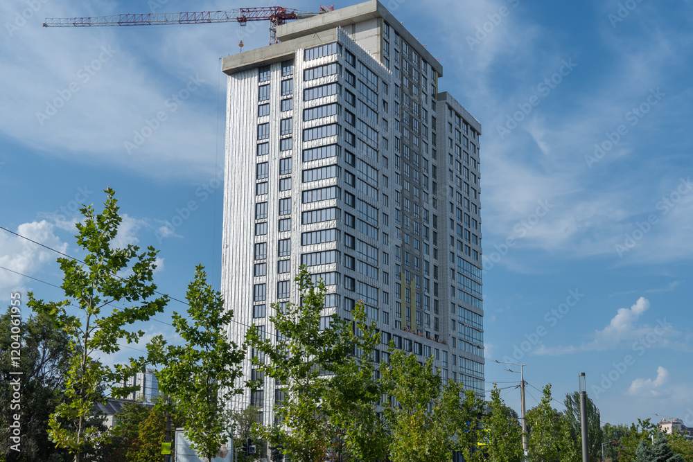 Fototapeta premium New multistorey skyscrapers in business district. Architectural details of luxury house and home complex. Fragment contemporary residential condominium. Geometry modern of apartment building exterior.