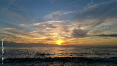 Golden Sunset over Calm Ocean Waves