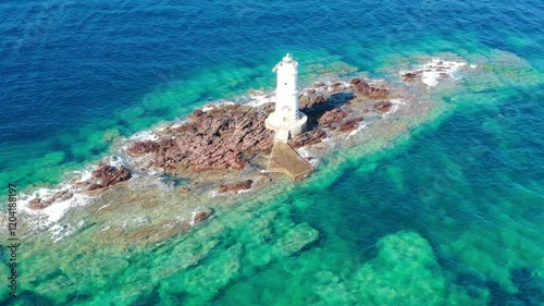 Mangiabarche lighthouse with high waves. Mangiabarche is the lighthouse located in Calasetta southwest Sardinia Italy