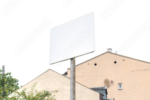 Blank white rectangular sign outdoors with trees and houses in the background, empty signage for advertising or information, mockup template for real estate or traffic purposes photo