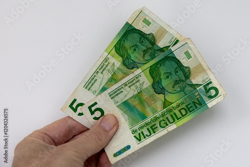 Dutch five guilder banknotes in hand