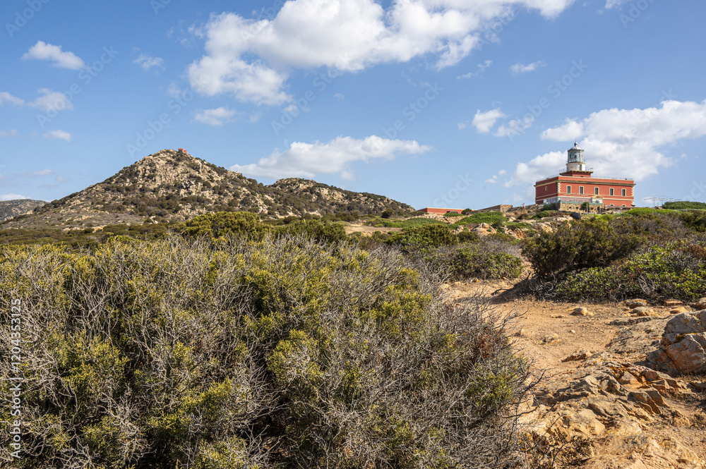 The beautiful red lighthouse of Capo Spargivento in southern Sardinia