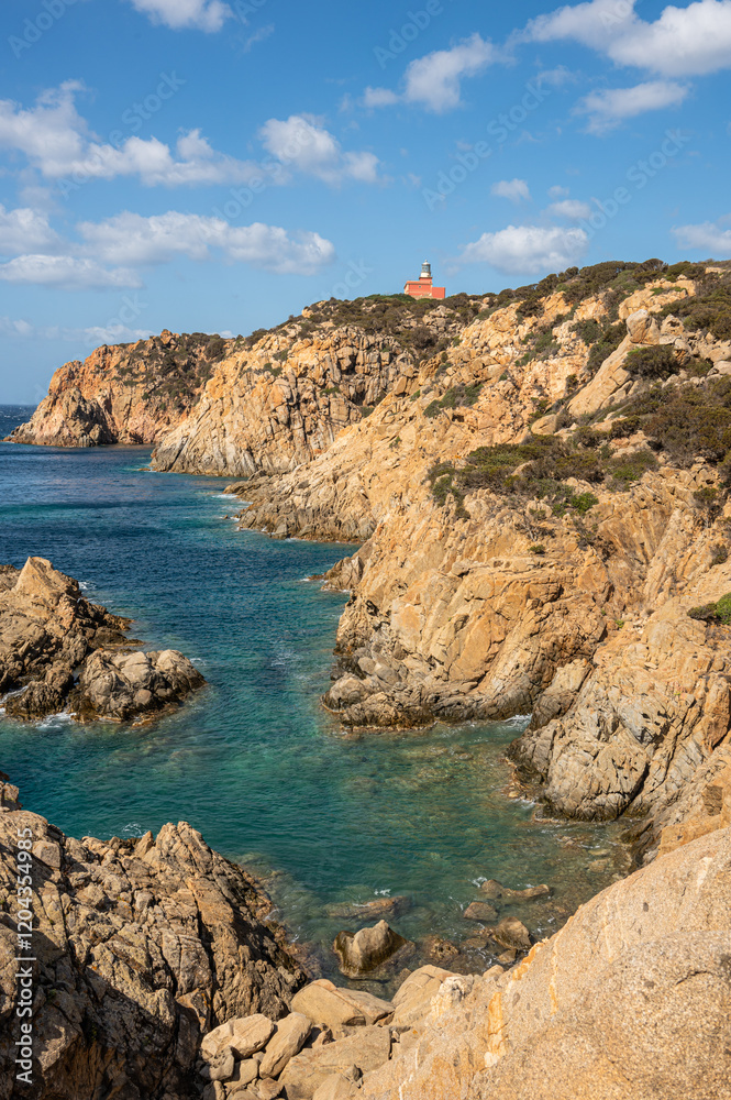 The beautiful Capo Spargivento in southern Sardinia with the red lighthouse dominating it from above