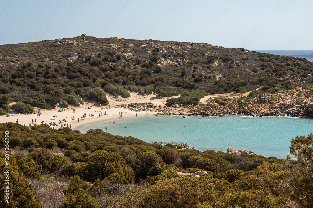 The beautiful beach of Cala Cipolla in Chia in Sardinia, with white sand and transparent and turquoise water