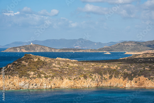 Obraz na płótnie Landscape of the south-west coast of Sardinia with cliffs, blue sea, fjords and white clouds w salonie