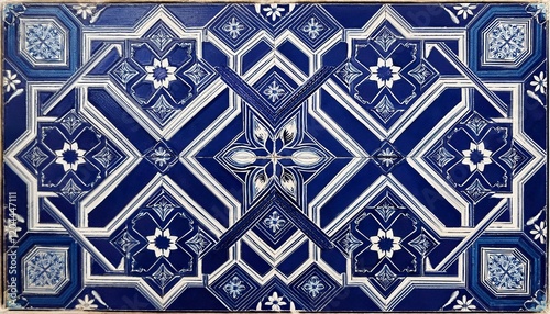 A Moroccan-inspired tile featuring a bold star and cross pattern in rich navy blue and white, creating a striking contrast and an exotic, traditional feel.