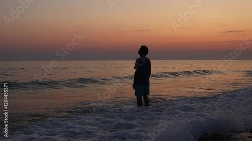 Depressed man on beach during sunset