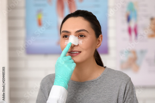 Plastic surgeon's hand and ...