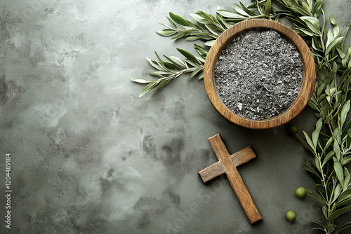 Above view of bowl with burnt ashes, wooden Christian cross and olives on gray concrete background, Ash Wednesday concept photo