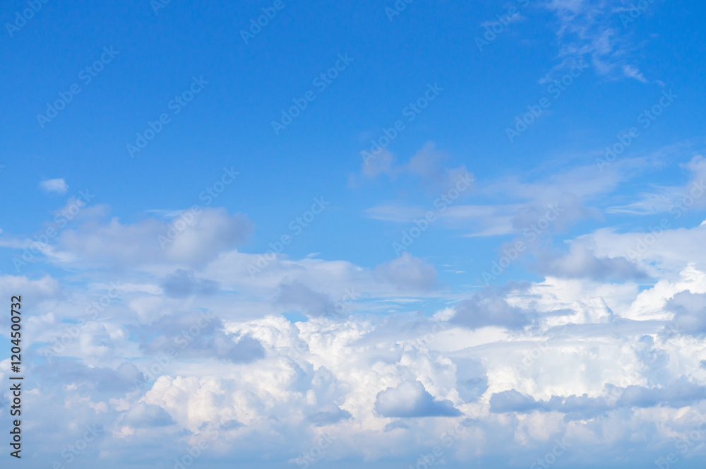 White fluffy clouds, sun and blue sky. Majestic view in summer. White fluffy clouds, sun and blue sky. Majestic view in summer.